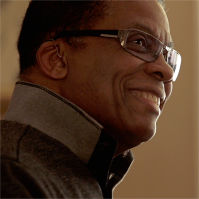 Portrait of Herbie Hancock smiling.