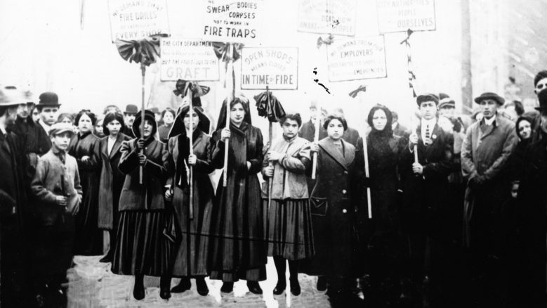 Black and white photograph of mourners picketing after the Triangle Fire.