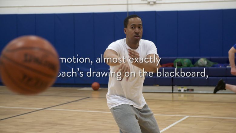 A man throws a basketball in a pick-up basketball game