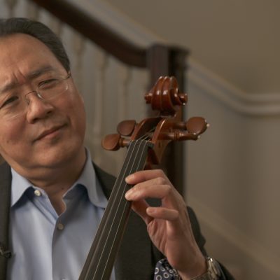 Portrait of Yo-Yo Ma holding a string instrument.