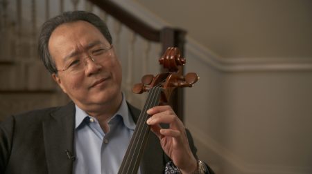 Portrait of Yo-Yo Ma holding a string instrument.