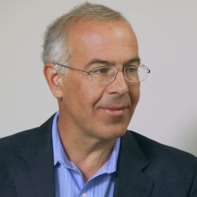 Portrait of David Brooks smiling.