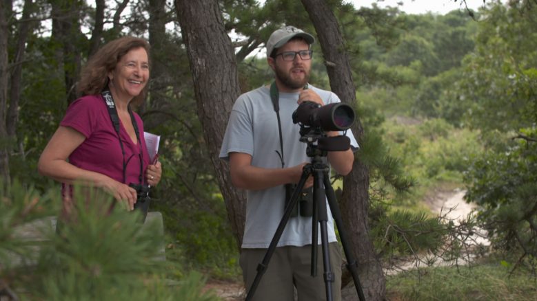 Host Elisa New and naturalist Joel Wagner enjoy a moment of bird-watching at Mass Audubon's Wellfleet Bay Wildlife Sanctuary on Cape Cod