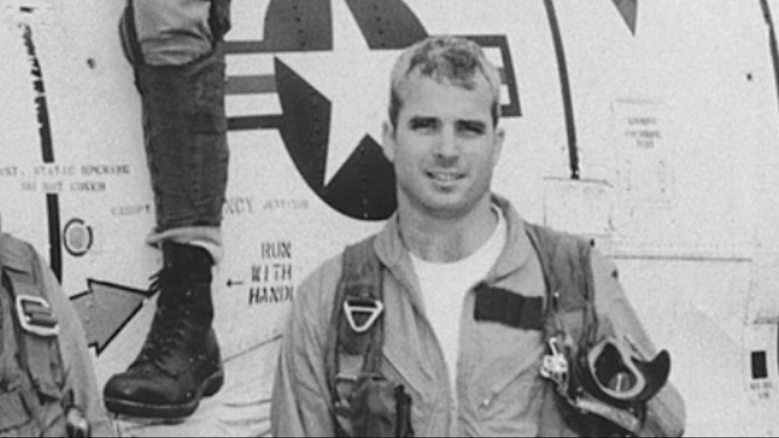 Black and white portrait of John McCain smiling.