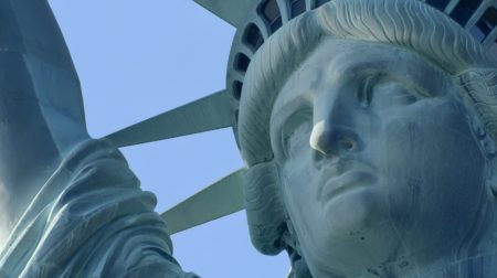 An upclose shot of the Statue of Liberty.