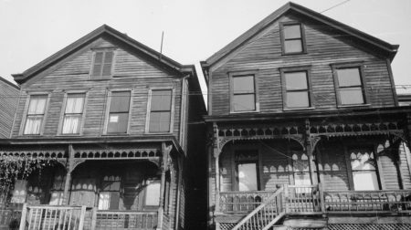 Black and white photograph of two houses.