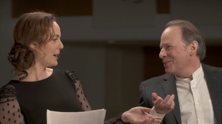 Melissa Errico on the left and Adam Gopnik on the right, in mid-conversation.