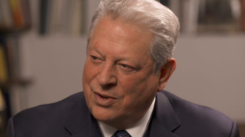 Portrait of Al Gore wearing a suit and in the middle of speaking.