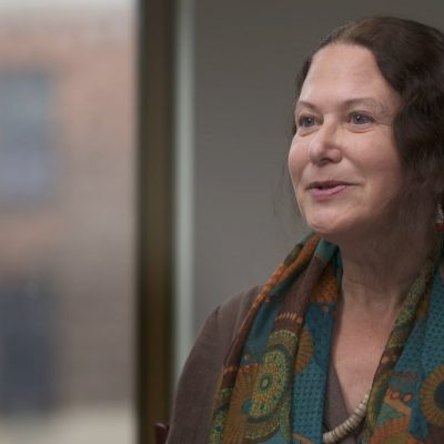 Portrait of poet Jane Hirshfield smiling.