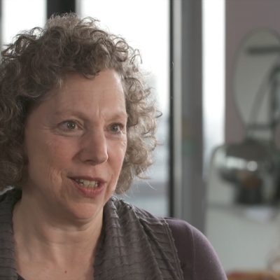 Portrait of professor Elizabeth Reis in the middle of speaking.