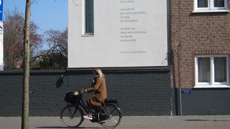 The poem, "This Is Just to Say" printed on the side of a building in Netherlands