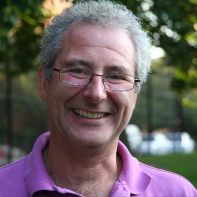 Headshot of Peter Rhodes smiling