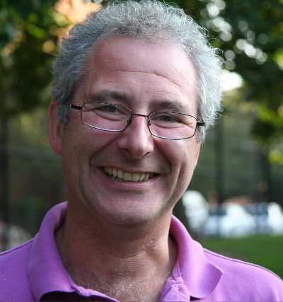 Headshot of Peter Rhodes smiling