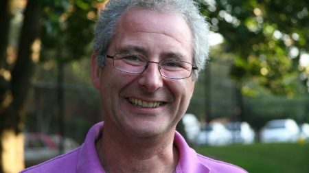 Headshot of Peter Rhodes smiling