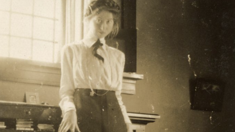 Pulitzer Prize-winning poet Marianne Moore stands near her desk in Carlisle, Pennsylvania.