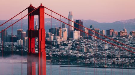 The Golden Gate Bridge with a city backdrop