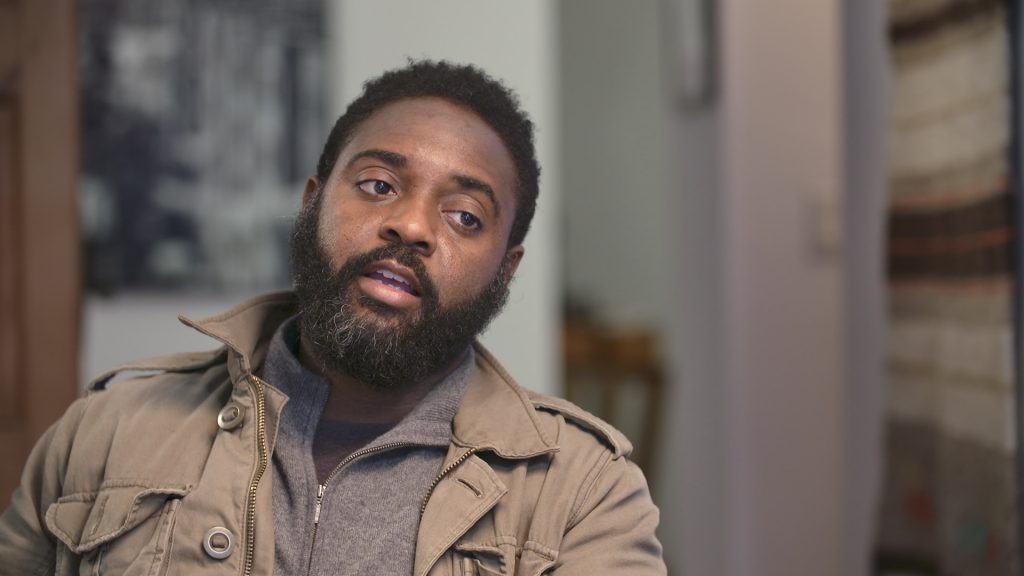 Portrait of Reginald Dwayne Betts in the middle of speaking