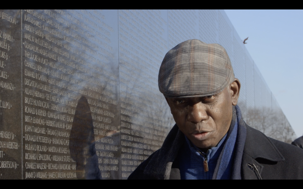Yusef Komunyakka in the middle of speaking.