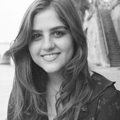 Black and white headshot of Camille Jacobson smiling