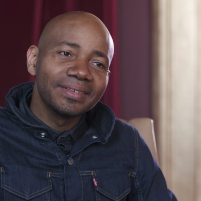 Portrait of DJ Spooky smiling