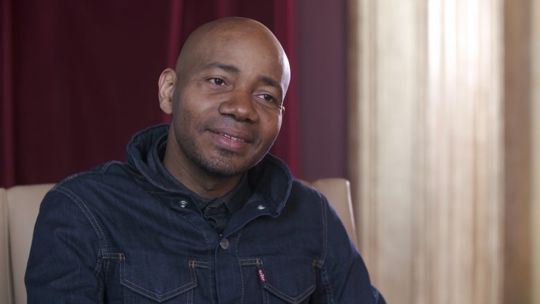 Portrait of DJ Spooky smiling