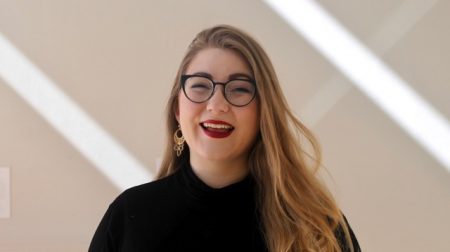 Portrait of Siriana Lundgren wearing a black top and smiling.