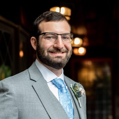 Portrait of Matt Freund wearing a suit while smiling