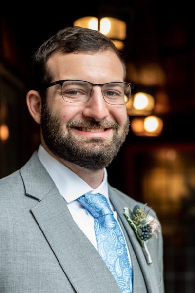 Portrait of Matt Freund wearing a suit while smiling