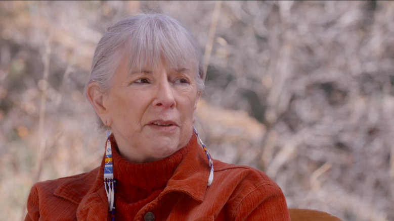 Poet Linda Hogan looks off to the side while in the middle of speaking