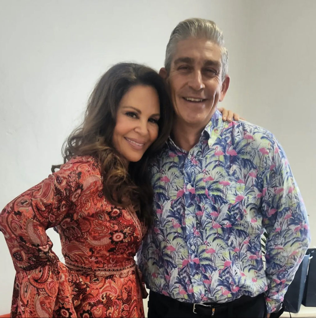 Richard Blanco and Nely Galán pose together and smile