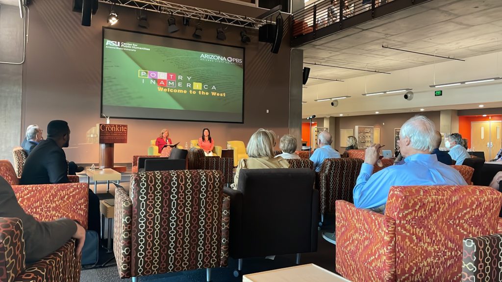 Elisa New and Patty Talahongva are seated on a stage as they welcome guests to Poetry in America's Welcome to the West event.