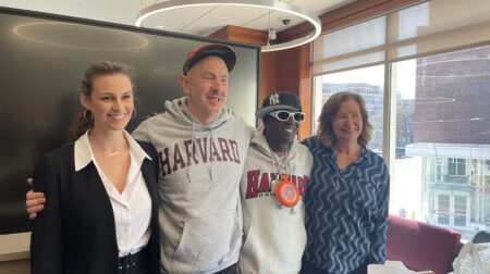 From left to right: talent manager Rhiannon Rae Ellis, songwriter Sam Hollander, rapper Flavor Flav, and professor Elisa New at Harvard Extension School.