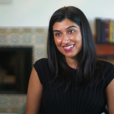 Natasha Sarin smiles while wearing a black shirt