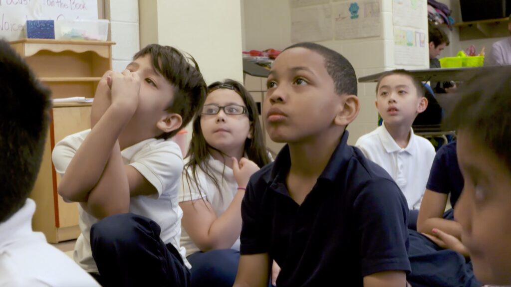 Young students engaged in a poetry lesson